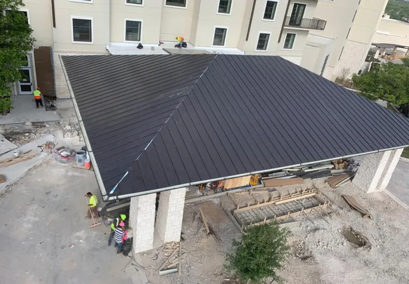 Metal roofing installation team working on a commercial building in South Apopka