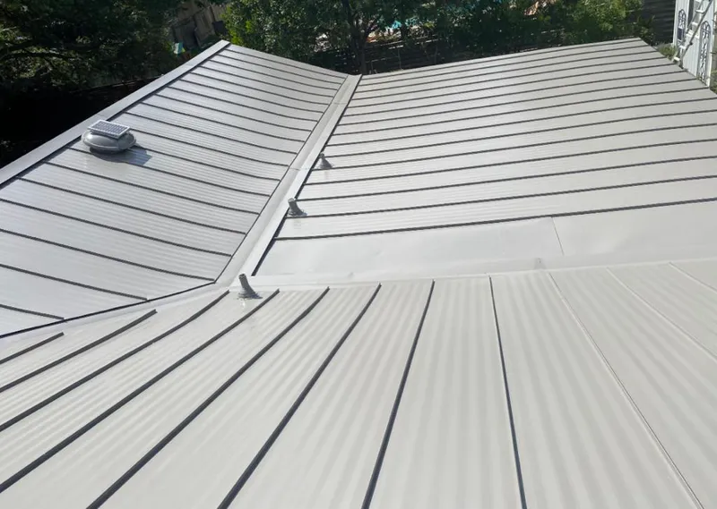Solar attic fan installed on a metal roof for Roof Ventilation in South Apopka